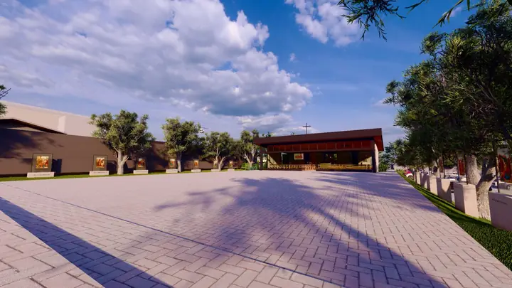 Praça arborizada ao lado da Capela São José, com o calçamento e os prédios da comunidade.
